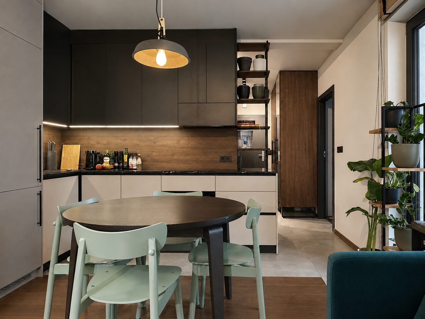 Modern kitchen with dining area, cashmere lower cabinets, grey fridge cabinetry and dark upper fronts